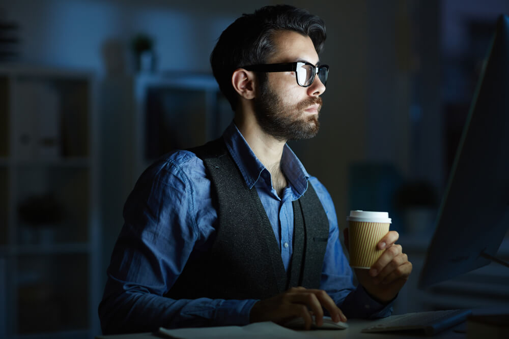 man working in dark room