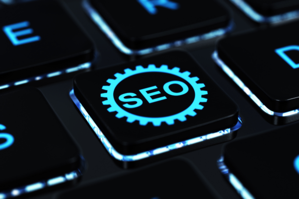 Keyboard with a key labeled SEO representing search engine optimization