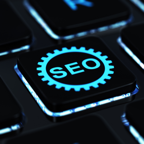 Keyboard with a key labeled SEO representing search engine optimization